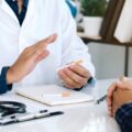 A doctor advising a patient not to smoke cigarettes.